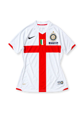 Inter Milan 2007-08 away jersey, front view, white with large red cross, black Nike swoosh, gold centenary crest, Scudetto shield, navy Pirelli sponsor, red cuffs