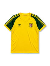 Wales 1982 away football shirt by Adidas in yellow with green three-stripe sleeves and FAW crest