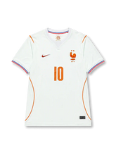 Kylian Mbappé #10 France 2026 World Cup away jersey in off-white with orange number 10 on the front and MBAPPÉ name and number 10 on the back.