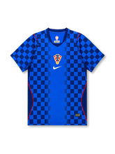 Croatia 2026/27 away shirt with a blue base, dark blue checkered sleeves and lower panels, central Croatia crest, white chest Swoosh, red piping accents, and V-neck collar.