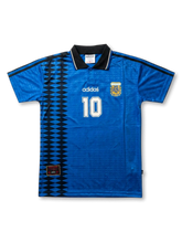 Front view of Argentina 1994 World Cup away shirt in blue with black geometric side panel, AFA crest, adidas logo, and number 10 on the front.