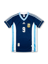 Front view of Argentina 1998 World Cup away shirt in dark navy with light blue V-neck, AFA crest, adidas logo, side panel detailing, and number 9 on the front.