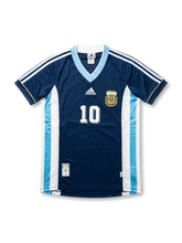 Front view of Argentina 1998 World Cup away shirt in dark navy with light blue V-neck, AFA crest, adidas logo, side panel detailing, and number 10 on the front.