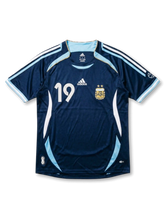 Front view of Argentina 2006 World Cup away shirt in dark navy with light blue trim, AFA crest, adidas logo, and number 19 on the front.