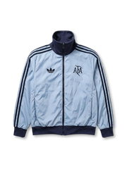 Argentina national team adidas Originals track jacket in sky blue satin-finish nylon with navy Three Stripes, navy ribbed stand collar and cuffs, Trefoil at left chest, vintage AFA monogram crest at right chest