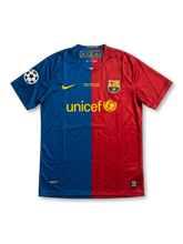 Front view of Barcelona 2009 Champions League Final home shirt in split blue and red with UNICEF sponsor, Rome final embroidery, club crest, and Champions League sleeve patch.