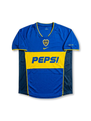 Front view of Boca Juniors 2004-05 home shirt in royal blue with gold chest band, Pepsi sponsor, centered swoosh, and CABJ crest.