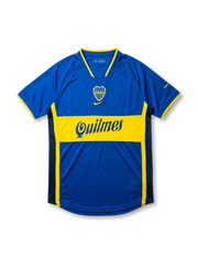 Front view of Boca Juniors home shirt in blue with yellow chest band, Quilmes sponsor, centered swoosh, and CABJ crest.