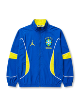 Brazil x Jordan track jacket front with embroidered CBF crest and yellow Jumpman logo