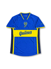 Boca Juniors Home Jersey Carlos Tevez #9, retro Argentine club soccer shirt featuring the iconic blue design with a horizontal yellow chest band, Boca Juniors club crest, and Tevez name and number 9 on the back.