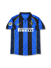 Inter Milan Home Jersey Ronaldo Nazário #9, retro Nike soccer shirt featuring the iconic black and blue vertical stripes, Inter Milan club crest, Pirelli sponsor logo, and Ronaldo name and number 9 on the back.