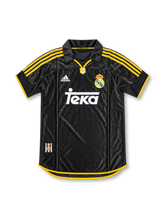 Real Madrid 1999/2000 Away Jersey, retro adidas soccer shirt featuring the classic dark navy blue design, Real Madrid club crest, adidas branding and Teka sponsor logo.