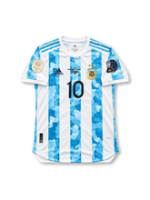 Argentina 2021 Copa América Final Home Jersey Lionel Messi #10, classic adidas soccer shirt featuring sky blue and white vertical stripes, Argentina national team crest, black adidas accents, and Messi name and number 10 on the back.
