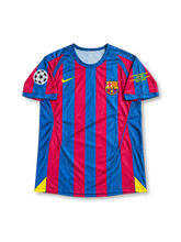 FC Barcelona 2005/06 UEFA Champions League Final Home Jersey Ronaldinho #10, classic Nike soccer shirt featuring blue and red vertical stripes, FC Barcelona crest, UNICEF sponsor logo, and Ronaldinho name and number 10 on the back.