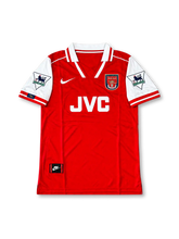 Arsenal FC 1995/96 Home Jersey Dennis Bergkamp #10, retro Nike soccer shirt featuring the classic red body with white sleeves, Arsenal club crest, JVC sponsor logo, and Bergkamp name and number 10 on the back.