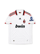 AC Milan 2009/10 Away Jersey Ronaldinho #80, classic adidas soccer shirt featuring the white away design with red and black accents, AC Milan club crest, Bwin sponsor logo, and Ronaldinho name and number 80 on the back.