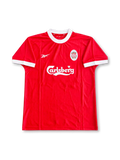 Front view of Liverpool 1998-2000 home shirt with red body, white crew-neck collar, white sleeve trim, Carlsberg sponsor, and Liverpool crest.