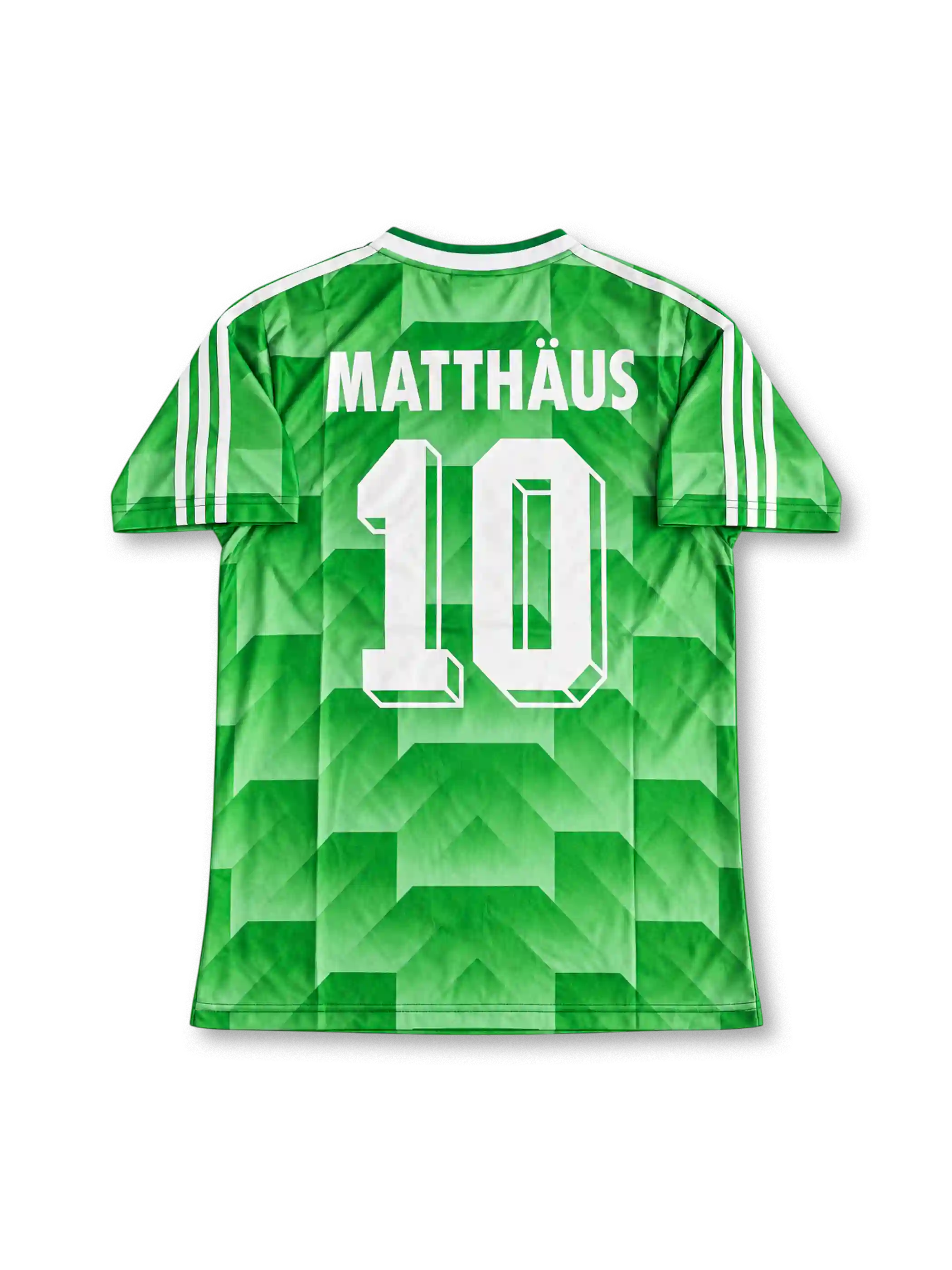 Front view of Germany 1990 World Cup away shirt with green geometric pattern, Germany crest, white V-neck collar, and white shoulder stripes.