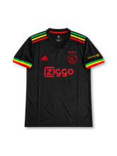 Ajax 2021-22 special edition soccer jersey in black with red, yellow and green shoulder stripes and sleeve trim, Ajax club crest, sponsor logo, Bob Marley-inspired portrait artwork, musical symbols, handwritten-style messages and colorful graphics across the front and back.