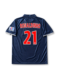 Paris Saint-Germain 2001-02 home jersey featuring Ronaldinho #21, Nike navy blue soccer shirt with an offset red vertical stripe, white V-neck detailing, OPEL sponsor logo, Nike Swoosh, PSG club crest, and RONALDINHO name and number 21 on the back of this retro soccer jersey.