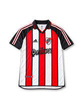 River Plate 2001 tricolor jersey featuring Ariel Ortega #10, adidas red, white and black vertical striped soccer shirt with black polo collar and sleeves, three-stripe shoulder detailing, Quilmes sponsor logo, River Plate club crest, and ORTEGA name and number 10 on the back.