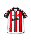 River Plate 2001 tricolor jersey featuring Ariel Ortega #10, adidas red, white and black vertical striped soccer shirt with black polo collar and sleeves, three-stripe shoulder detailing, Quilmes sponsor logo, River Plate club crest, and ORTEGA name and number 10 on the back.