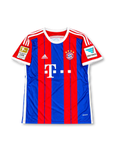 Bayern Munich 2014-15 home jersey featuring Toni Kroos #39, adidas red and royal blue vertically striped soccer shirt with a white crew neck, white three-stripe shoulder detailing, Deutsche Telekom sponsor logo, gold FIFA Club World Champions badge, Bayern Munich crest, and KROOS name and number 39 on the back.