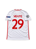 AS Monaco 2016-17 home jersey featuring Kylian Mbappe #29, Nike red and white diagonal split soccer shirt with subtle tonal horizontal graphics, white sleeves, red-trimmed V-neck collar, FEDCOM sponsor logo, AS Monaco club crest, UEFA Champions League and Respect sleeve patches, and MBAPPÉ name with number 29 on the back.