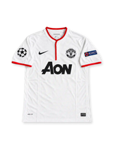 Manchester United 2012-13 away jersey featuring Wayne Rooney #10, white Nike soccer shirt with a red-trimmed Henley collar and sleeve cuffs, black Nike Swoosh, monochrome Manchester United crest, black Aon sponsor logo, UEFA Champions League and Respect sleeve patches, and ROONEY name with black number 10 on the back.