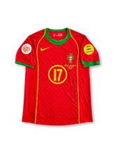 Portugal 2004 UEFA European Championship home jersey featuring Cristiano Ronaldo #17, red Nike Total 90 soccer shirt with subtle tonal geometric patterns, green crew neck and sleeve cuffs, yellow piping and Nike Swoosh, Portugal national team crest, yellow circled number 17 on the front, and C. RONALDO name with number 17 on the back.