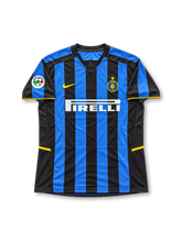 Inter Milan 2002-03 home jersey featuring Gabriel Batistuta #19, Nike blue and black vertical striped soccer shirt with a black V-neck collar, yellow sleeve and hem accents, yellow Nike Swoosh, white Pirelli sponsor logo, Inter club crest with a gold star, and BATISTUTA name with white number 19 on the back.