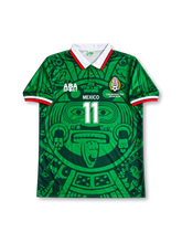 Mexico 1998 FIFA World Cup home jersey featuring Cuauhtemoc Blanco #11, green ABA Sport soccer shirt with a striking dark green Aztec Sun Stone calendar graphic, white polo collar with red trim, red and white sleeve cuffs, ABA Sport branding, MEXICO lettering, national team crest, white front number 11, and BLANCO name with number 11 on the back.