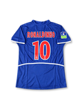 Paris Saint-Germain 2002-03 home jersey featuring Ronaldinho #10, Nike navy blue soccer shirt with an offset red vertical stripe bordered by thin white lines, white-trimmed V-neck collar, white Nike Swoosh, THOMSON sponsor logo, PSG club crest, LFP sleeve patch, and RONALDINHO name with number 10 on the back.