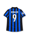 Front view of the 1998/99 Inter Milan home soccer jersey featuring black and blue vertical stripes, a yellow Nike Swoosh, Inter crest with gold star, white Pirelli sponsor, and UEFA Champions League sleeve patch.