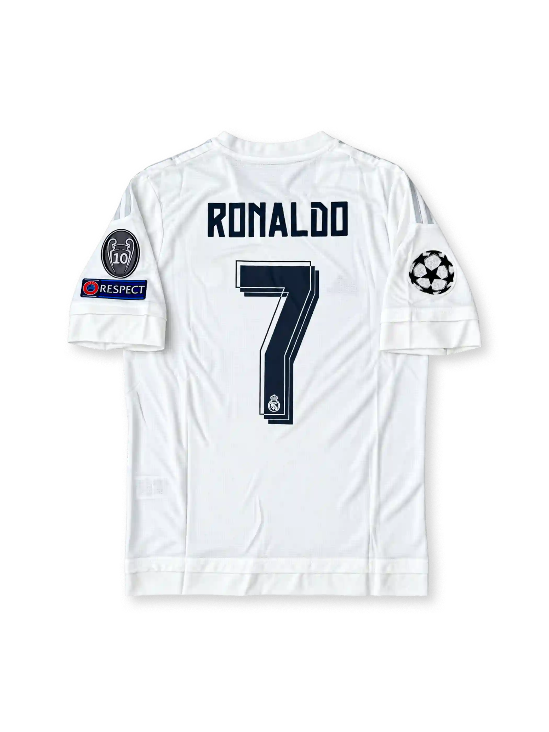 Front view of the Real Madrid 2015/16 white home soccer jersey featuring silver adidas shoulder stripes, dark navy Fly Emirates sponsor, crowned club crest, UEFA Champions League starball patch, 10-time European Cup winners badge, and UEFA Respect sleeve patch.
