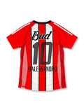 Front view of the River Plate 2002/03 red and white striped away soccer jersey featuring a black V-neck collar, red adidas shoulder stripes, club crest, Budweiser sponsor, and textured mesh side panels.