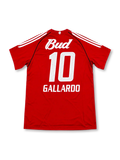 Front view of the River Plate 2003/04 away soccer jersey featuring red sleeves, red white and black vertical stripes, a black V-neck collar, white adidas shoulder stripes, River Plate crest, and Budweiser sponsor.