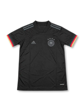 Front view of the Germany 2020 black away soccer jersey featuring a tonal DFB crest with four stars, gray adidas shoulder stripes, monochrome adidas logo, black V-neck collar, and black red and gold sleeve cuffs.