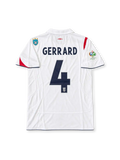 England 2005-07 white Umbro home jersey featuring asymmetric red St George's Cross detailing, navy trim, Three Lions crest, Germany 2006 World Cup sleeve patch and Steven Gerrard number 4.