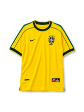 Brazil 1998 World Cup home jersey, front view, yellow body with dark green crew neck collar and cuffs, green shoulder piping, Nike swoosh, CBF crest with four gold stars, BRASIL wordmark
