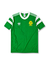 Cameroon 1990 World Cup home jersey in green with white shoulder stripes and Indomitable Lions crest