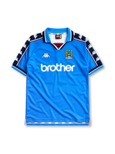 Manchester City 1997/98 home jersey in sky blue with navy Kappa sleeve panels and Brother sponsor branding
