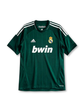 Real Madrid 2012/13 third jersey in dark green with white adidas stripes and 110th anniversary detail