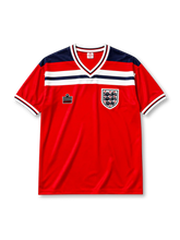 England 1982 World Cup away jersey in red with navy and white chest band and Three Lions crest