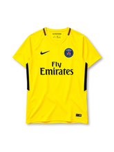 Paris Saint-Germain 2017/18 yellow Nike away jersey with navy side panels and Fly Emirates sponsor