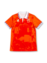 Netherlands 1996 home jersey, front view, bright orange with tonal photographic print, white polo collar with red white and blue trim, Lotto logo, KNVB lion crest, white sleeve cuffs
