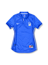 Italy 1998 home jersey, front view, royal blue with tonal texture, fold-over collar, white Nike swoosh, FIGC crest with three stars, white side piping, ribbed blue cuffs with white trim, Nike jock tag