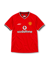 Manchester United 2000/02 red home jersey with Umbro logo, Vodafone sponsor, club crest, and black-and-white V-neck trim, front view.