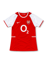 Arsenal 2002/04 red home jersey with white sleeves, Nike Swoosh, Arsenal cannon crest, and large white O2 sponsor, front view.