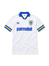 Parma 1993/95 white away jersey featuring blue Umbro branding, Parma A.C. crest, blue-and-yellow collar and sleeve trim, and Parmalat sponsor, front view.